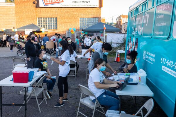 Community members in front of Vaccine Van
