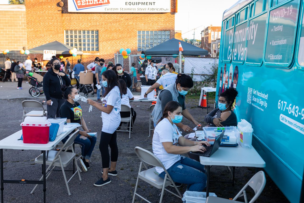Community members in front of Vaccine Van