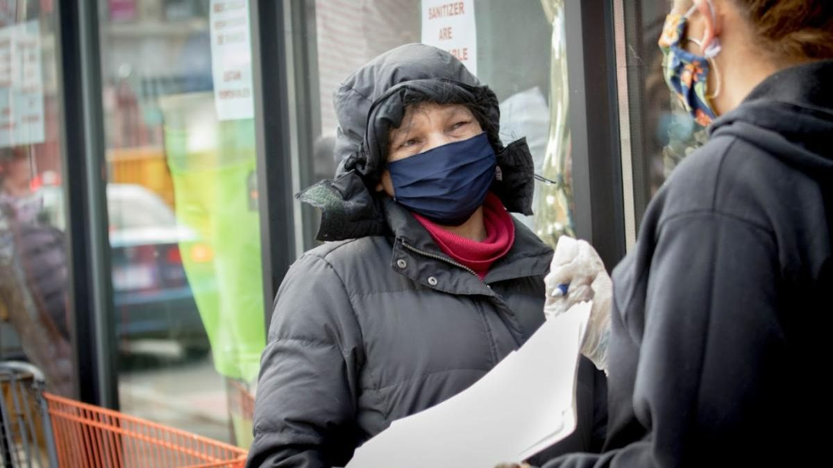 staff speaking to community member