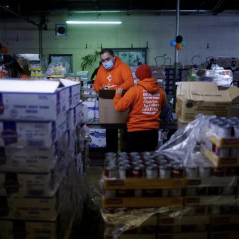 People working inside at the food bank