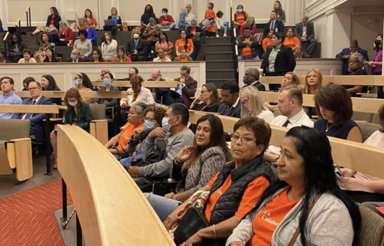 People inside wearing La Colaborativa shirts