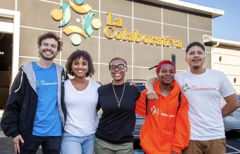 People standing in front of La Colaborativa