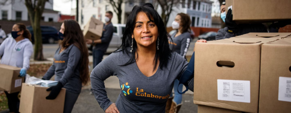 Gladys Vega in front of food pantry